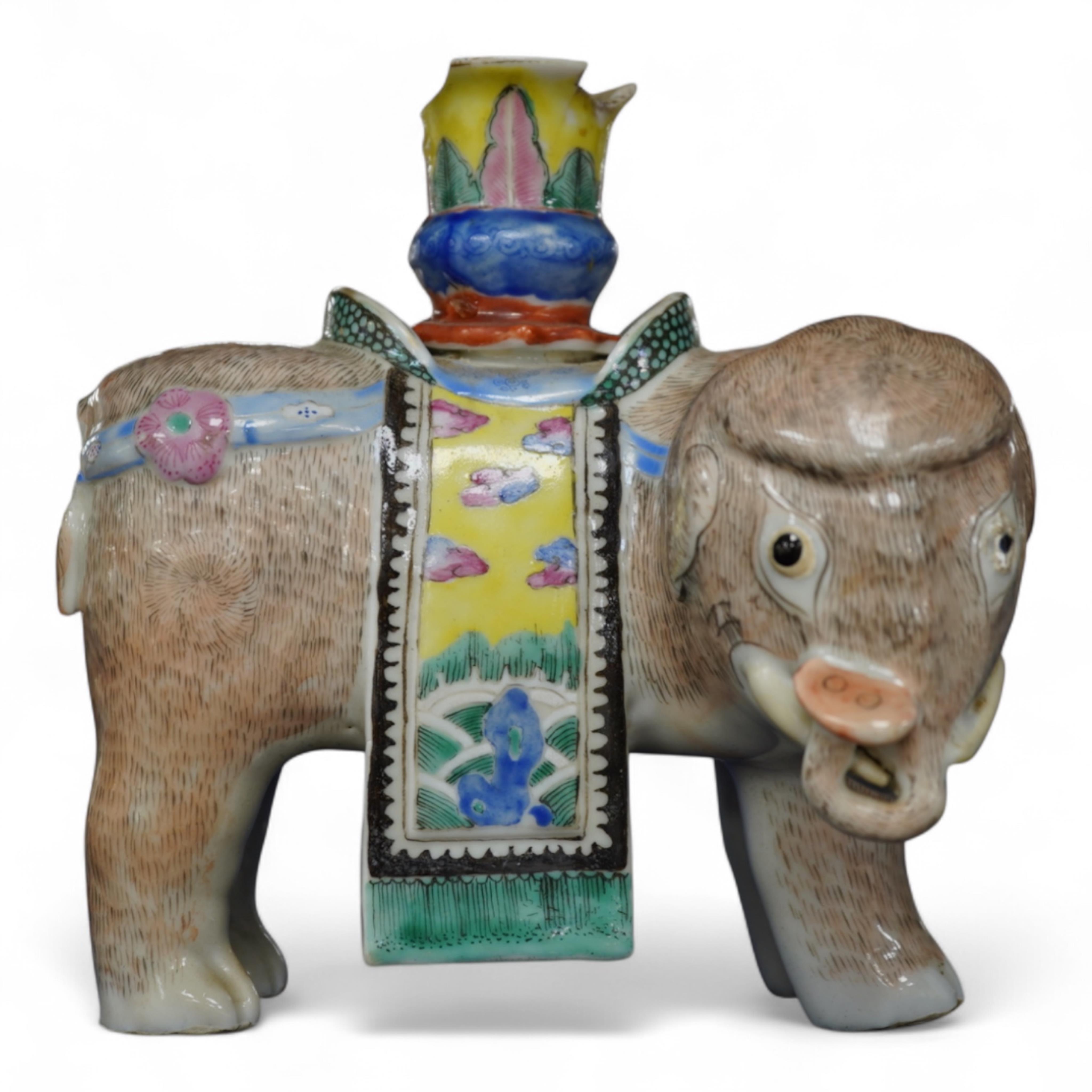 A 19th century Chinese enamelled porcelain vase in the form of an elephant with a howdah on its back
